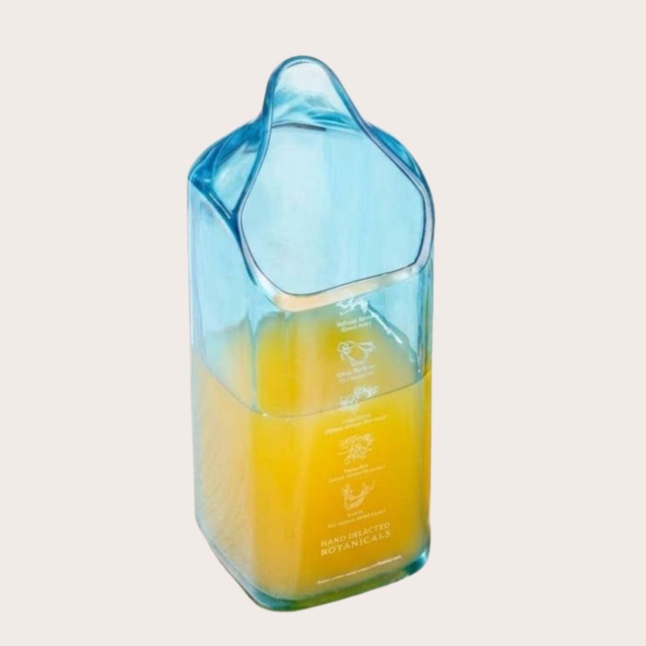 Kavi The Poetry-Art Project Bombay Sapphire tall glass jug for beverages, elegant clear drinkware with a sleek design.