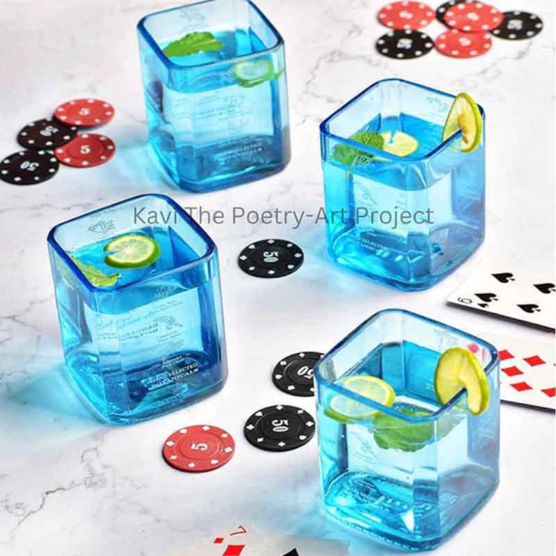 Set of four Kavi Bombay Sapphire glasses from Kavi The Poetry-Art Project, featuring elegant drinkware with intricate design details.