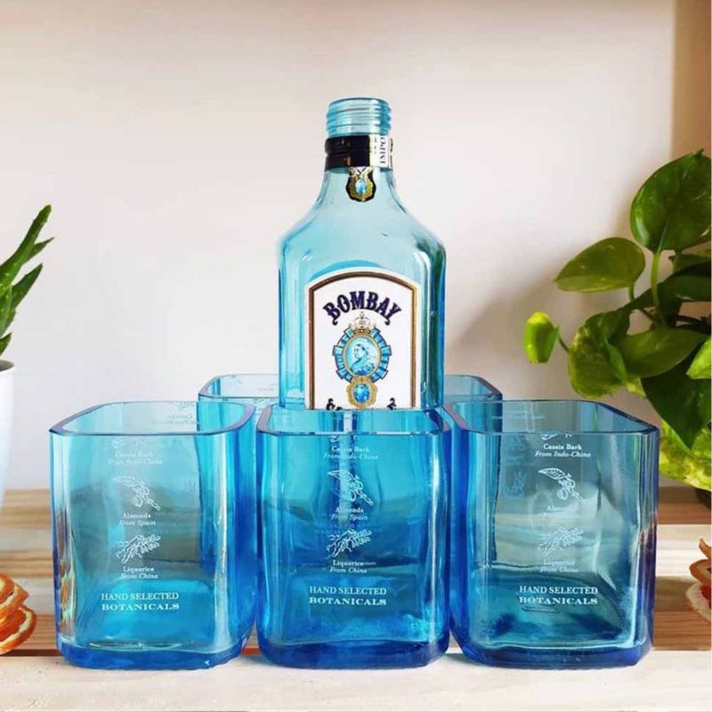 Set of six Kavi Bombay Sapphire glasses from Kavi The Poetry-Art Project, elegant drinkware for cocktails and spirits.