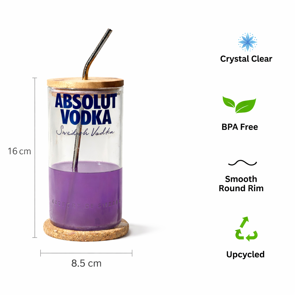 Kavi Upcycled Absolut tall glass with artistic design, eco-friendly drinkware by Kavi The Poetry-Art Project, showcasing a sleek transparent glass.